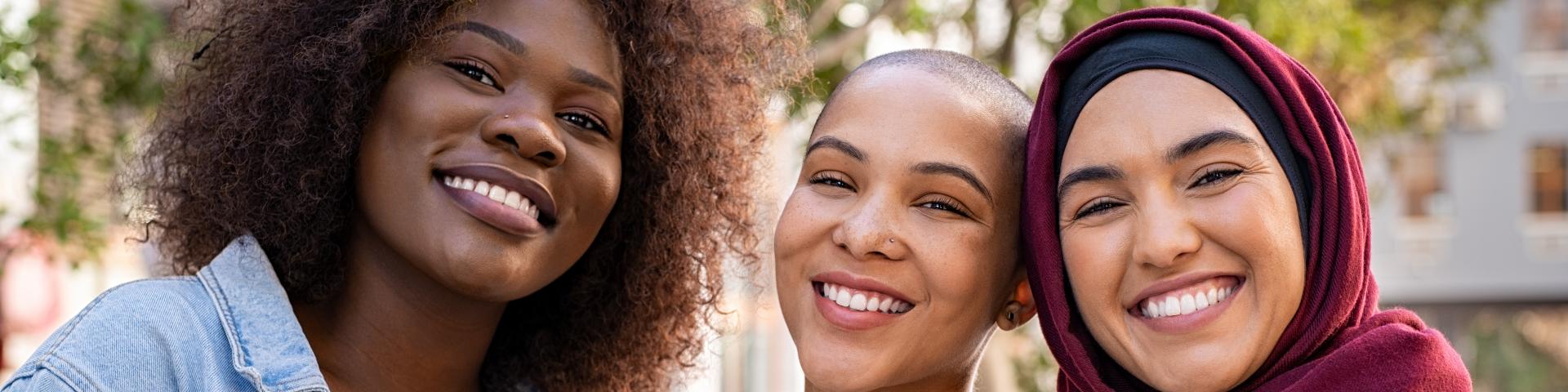 Three women smiling